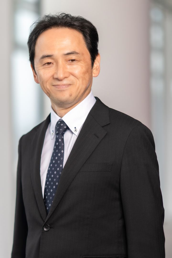 Portrait of Eiichi Akashi (suit, tie and NISSAN corporate pin)