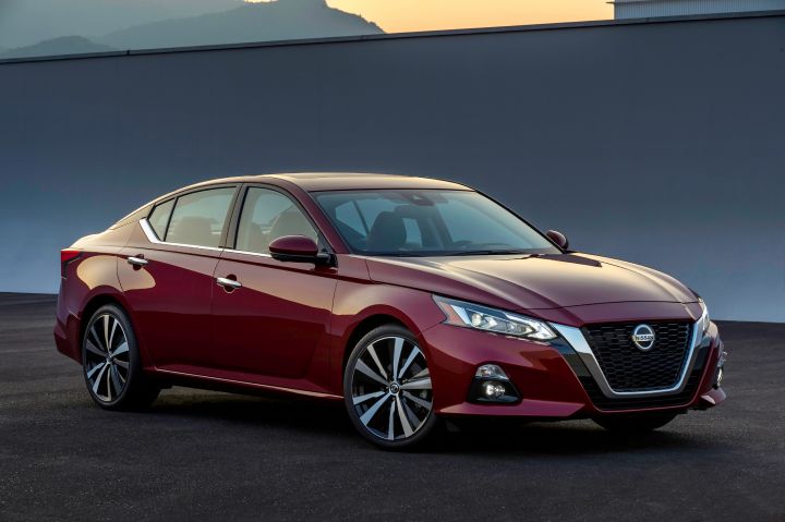 Front angled view of the passenger side of a red 2019 Nissan Altima