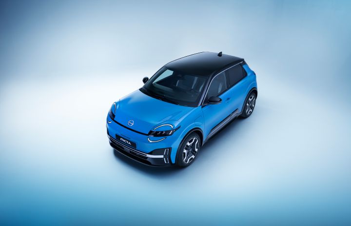 hero image of bird view of all new Nissan Micra in gear blue color showing signature headlamps. wheels, micra badge, black roof and wheels with side doors on driver side