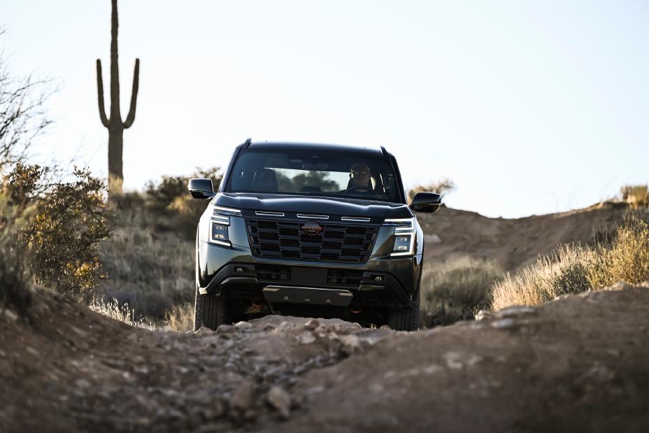 A Nissan Armada is driven in the desert facing the viewer.
