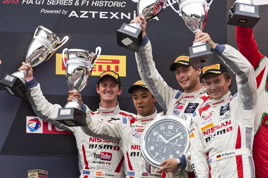 four drivers pictured holding their trophy’s