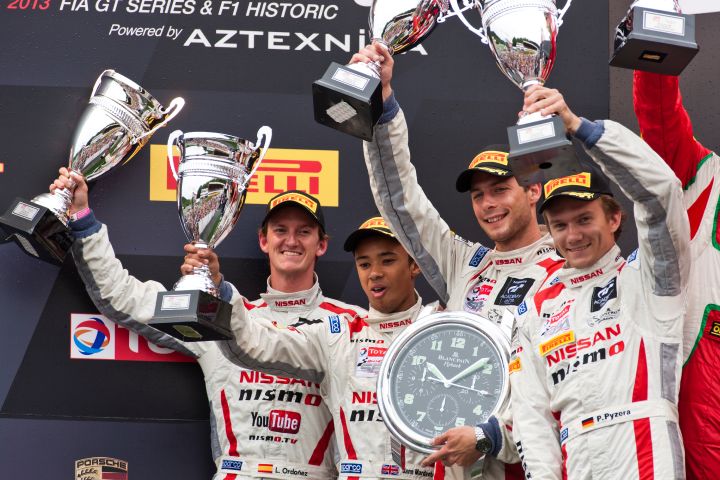 four drivers pictured holding their trophy’s