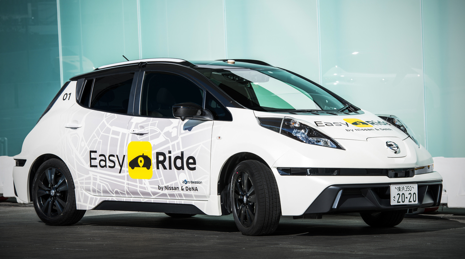 A Nissan Easy Ride is parked.