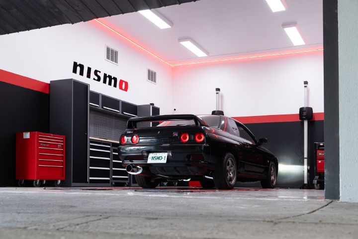 A black R32 GT‑R in the workshop of the new NISMO Performance Centre Melbourne.