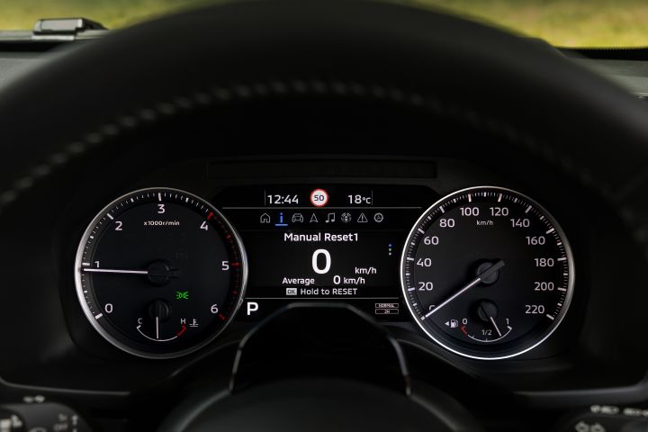 2026 Nissan Navara PRO-4X finished in Boulder Grey highlighting the cluster screen with Manual Reset 1 data, average speed reading and reset instruction.