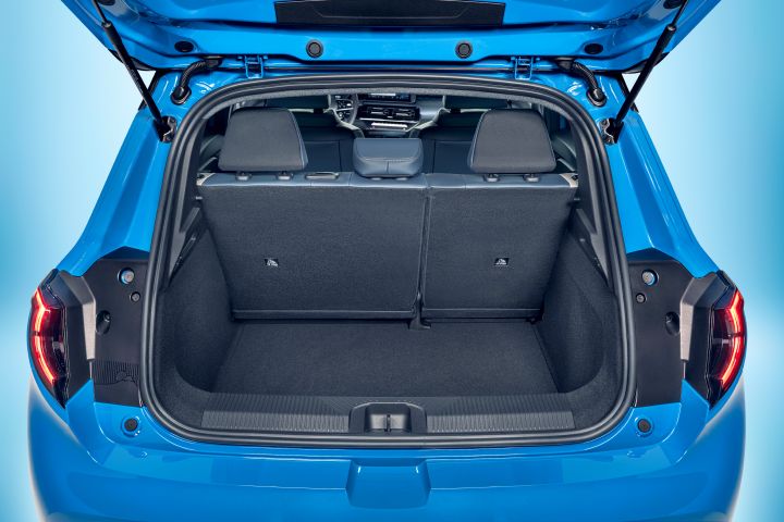focused view of Micra trunk space with open trunk door with upright seats