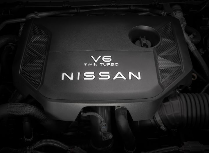 The black engine cover under the hood of a 2025 Nissan Armada that reads V6 Twin Turbo - Nissan.