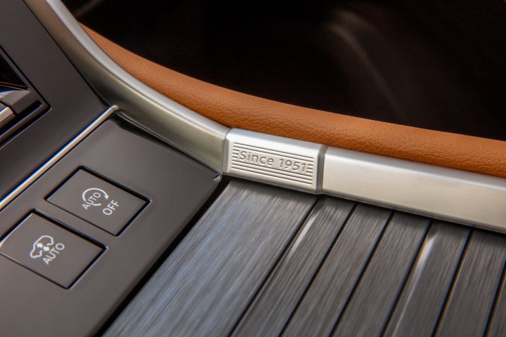 The "Since 1951" metal trim detailing on the center console area inside the 2025 Nissan Armada.