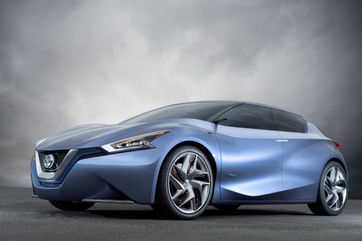 a front and side profile view of a parked Nissan Friend-ME Concept vehicle