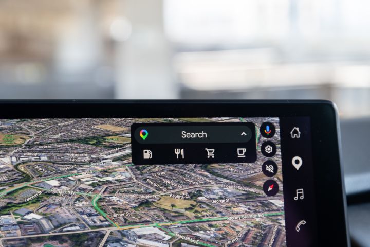 Close-up of the Nissan X‑Trail infotainment touchscreen, displaying Google Maps navigation with search and points of interest options.