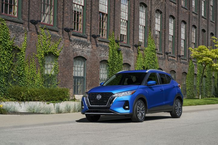 A blue Nissan Kicks parked on the road.