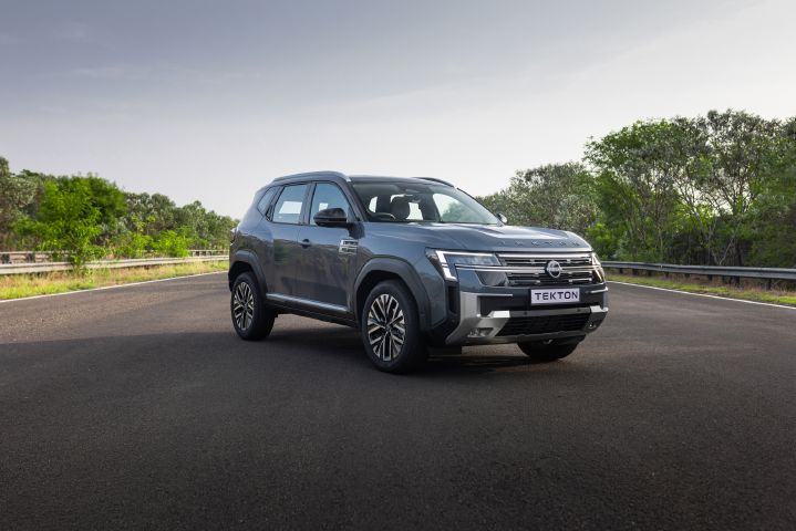 Front three-quarter view of the Nissan Tekton highlighting its bold SUV design, grille and alloy wheels.