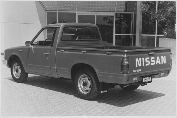 rear left view of a 1984 datsun 720 in black and white