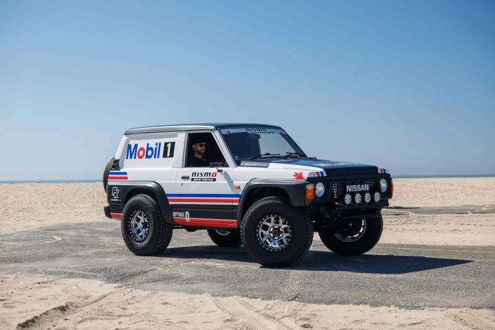 Front right 3/4 view of the Forsberg Racing Patrol SEMA build parked on gravel.