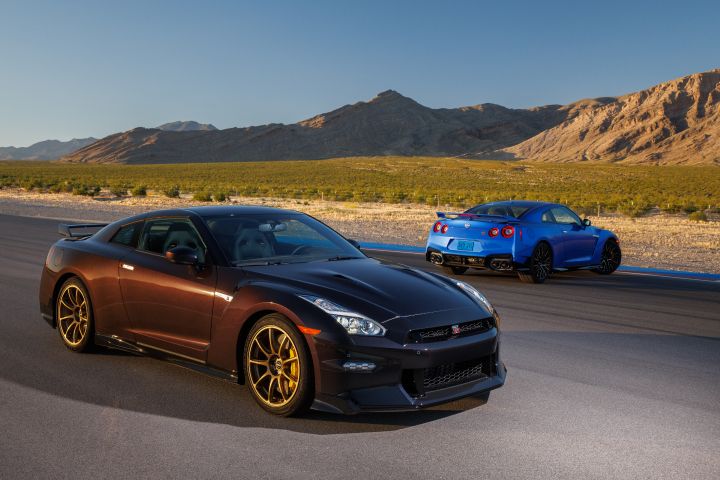 Two 2024 GT‑R Special Editions on a race track with a mountain in the background