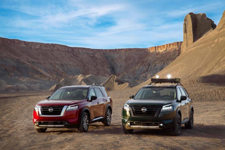 Two 2020 Nissan Pathfinders are parked in the desert.