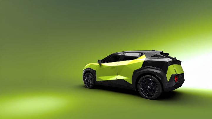 Against a bright green background, a Juke EV is shown from a rear three-quarter angle, facing to the left in a studio-like setting.