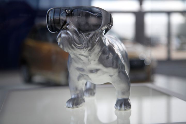 a dog figurine adorned with sunglasses