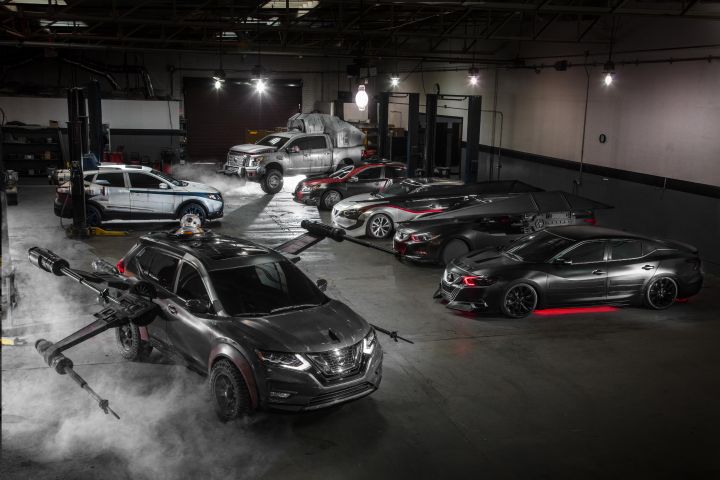 A collection of diverse Star Wars-themed vehicles displayed in a dimly lit garage with atmospheric fog.