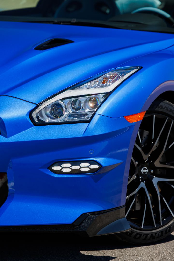 Closeup of the headlight of a blue 2024 GT‑R Special Edition