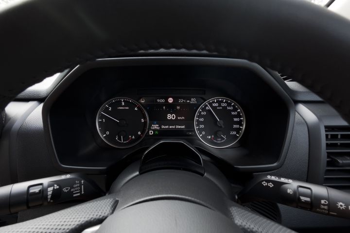Close-up of the 7-inch TFT Display Instrument Cluster in a 2026 Nissan Navara ST‑X, displaying current speed, trip information, and vehicle data between the analogue tachometer and speedometer.
