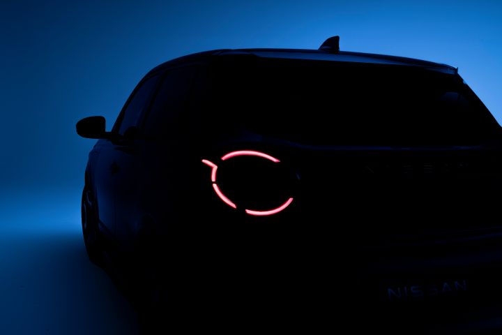 side rear view of Micra in dim light with left headlamps on