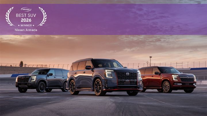 Three Nissan Armadas parked at different angles during sunset.