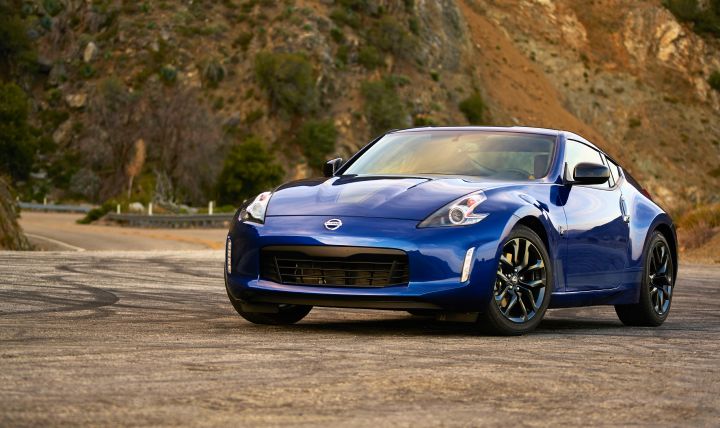 Front 3/4 view of the Nissan 370z parked on the side of the road.