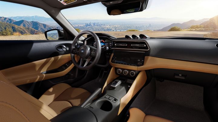 Angled view of the dashboard, steering wheel and windshield inside the 2027 Nissan Z.