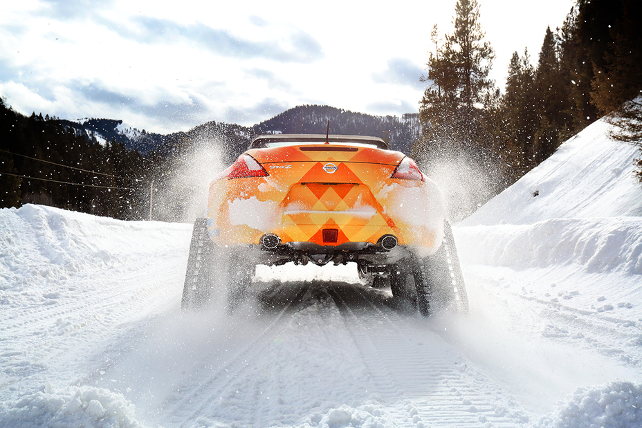 A low angle photo of the Nissan 370Zki driving on snow