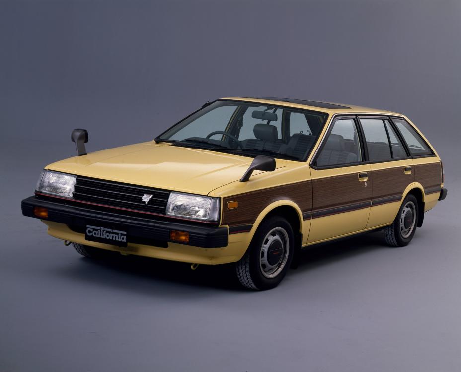 A yellow and brown 1981 1500 SGX-E wagon is parked on a gray background.