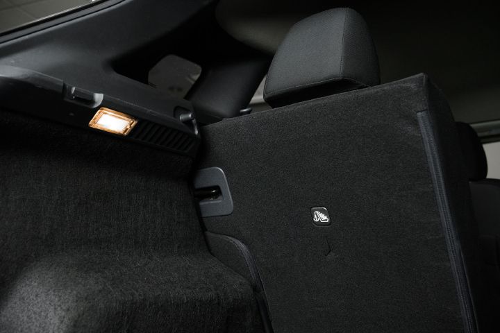 Close up of the trunk and back of the passenger seat fabric.