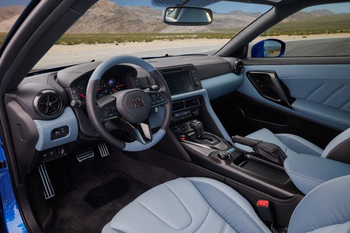 Interior of 2024 GT‑R Special Edition showing the dash and steering wheel with a desert viewable through the windshield